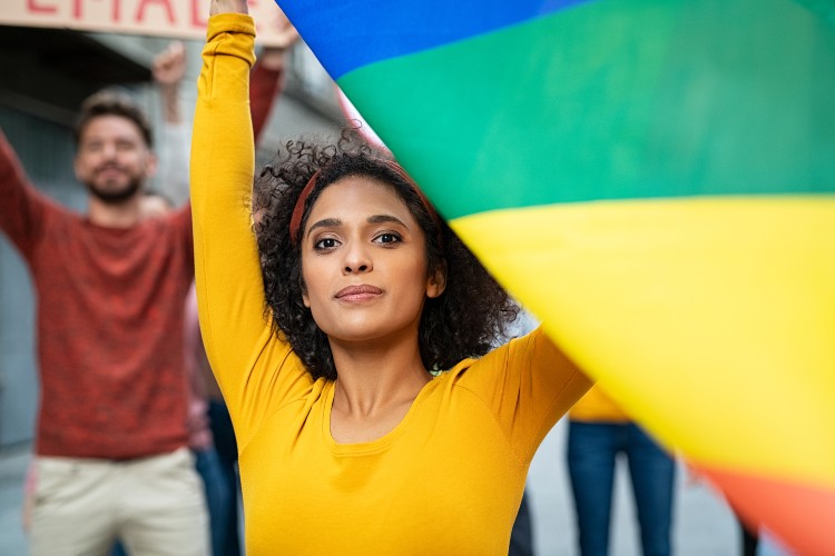 person with rainbow flag